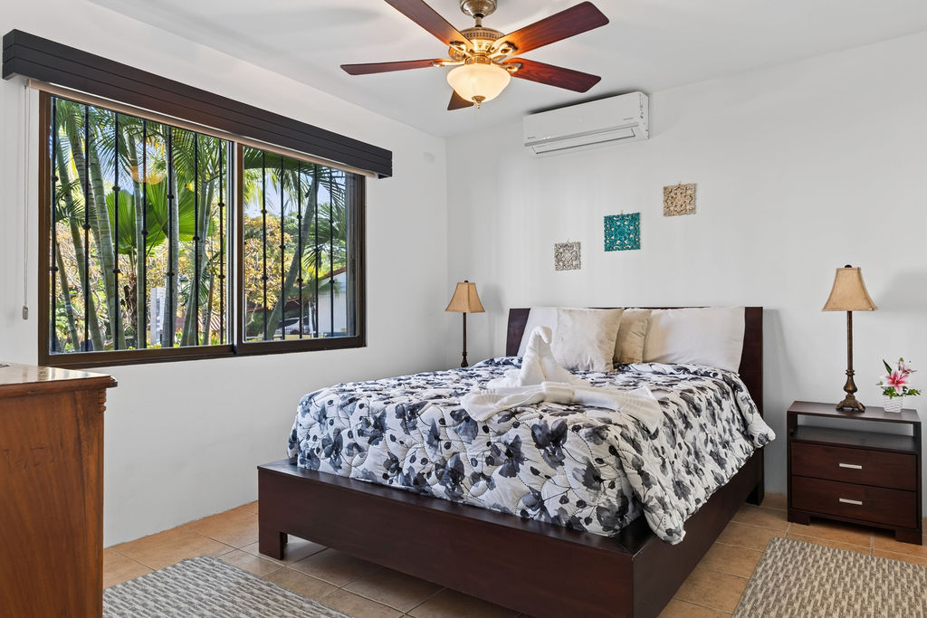 Second queen bedroom with garden window